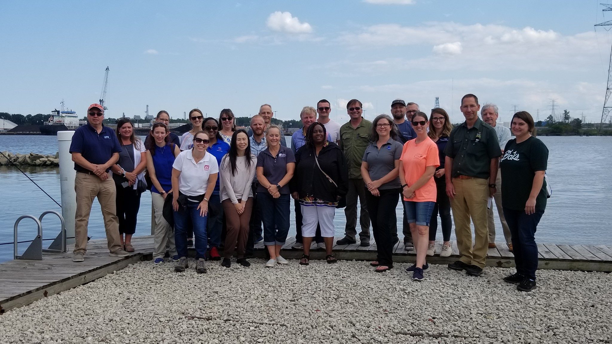 Members of the Maumee AOC Advisory Committee post in front of the Maumee River in 2021. Credit: Partners for Clean Streams